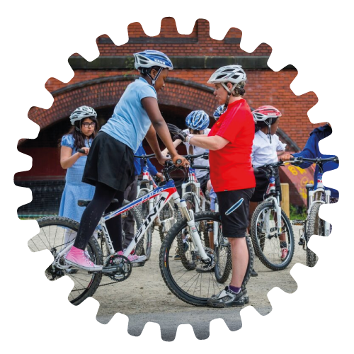 Group of children with cycling instructor