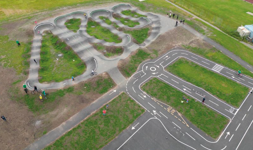 Aerial view of an outdoor BMX pump track and cycling learning zone