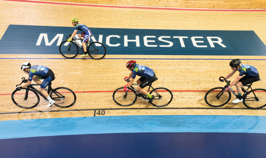 Group of racers on an indoor cycle track