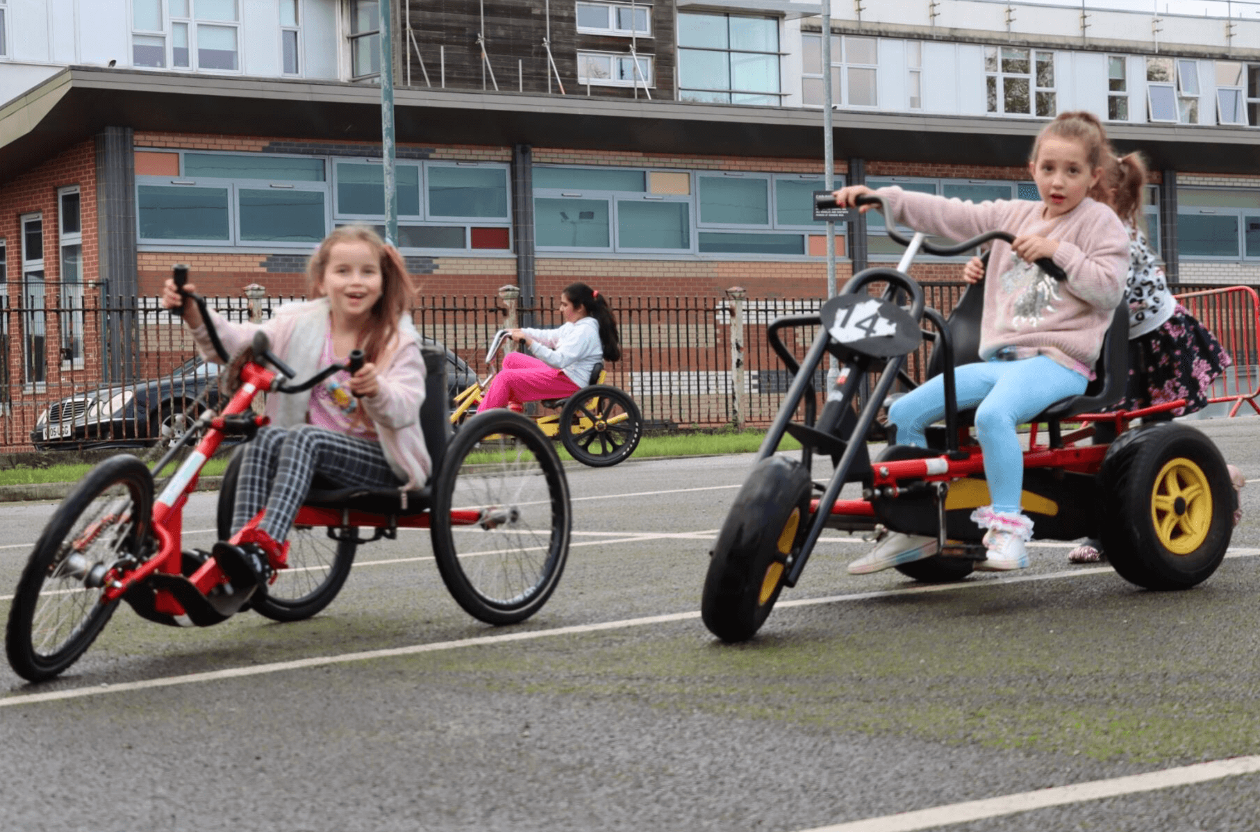 Two girls riding accessibility bikes