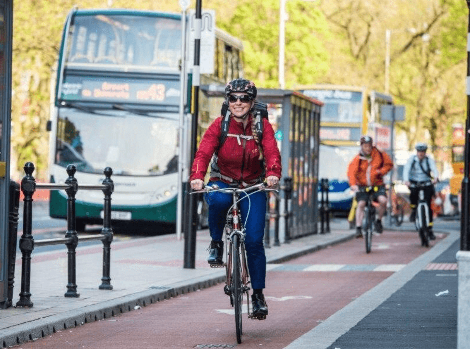 Cyclist riding down Wilmslow Road Cycleway