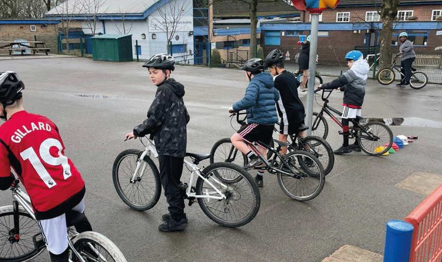 Children enjoying a free half-term holiday bike training session