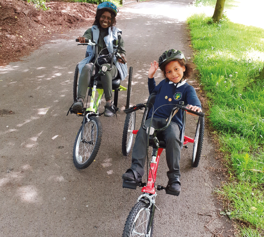 Woman and child enjoying Wheels for All Session at Debdale Park