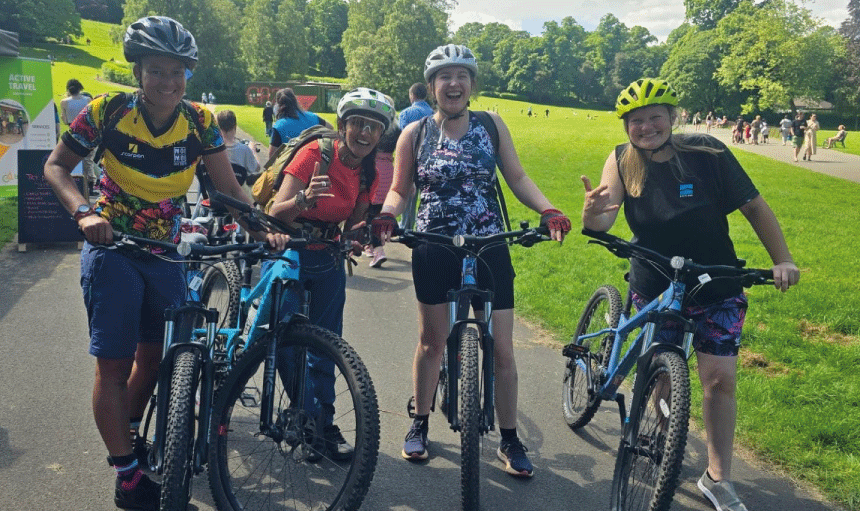 Belinda Everett with friends on bikes in park