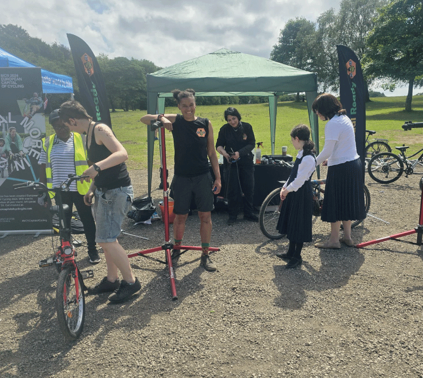 Bee Pedal Ready fixing bikes at Eid Cycle Festival in Heaton Park