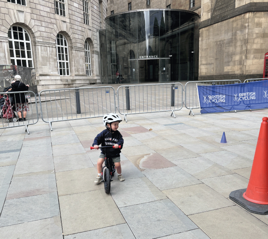 Child on bike in St Peter's Square during Manchester Day