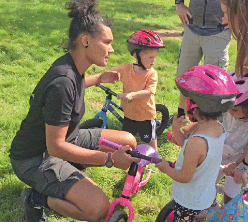 Belinda Everett helping kids with bike maintenance at the Wythenshawe Games