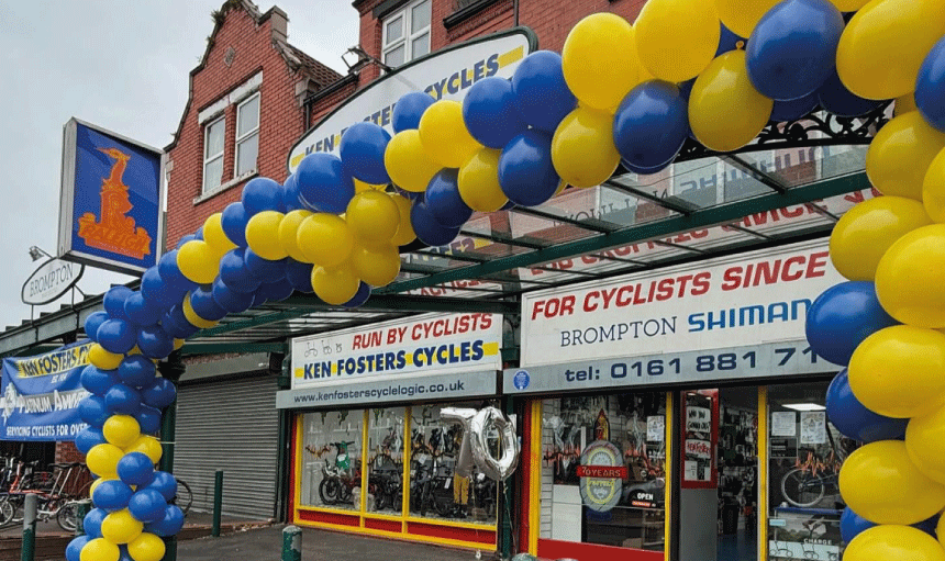 outside Ken Fosters Cycles for the shop's 70th anniversary